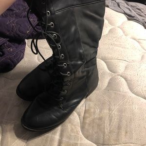 Knee high torrid combat boots.